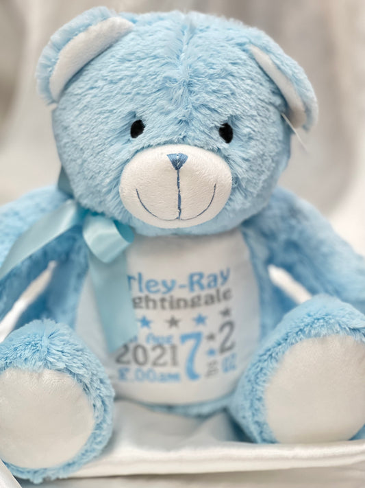 Personalised pastel blue teddy bear with embroidered name, featuring zipped bottom and removable inner pod for keepsakes or pyjamas