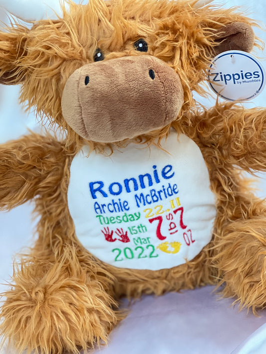 Soft plush highland cow toy with custom birth details